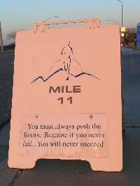 A real photo of one of the Valley of the Sun Marathon mile markers with motivatonal slogan.